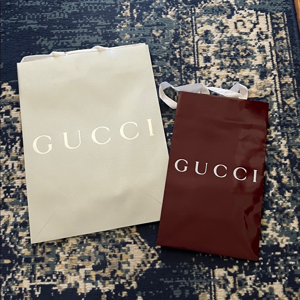 2 Gucci shopping bags
